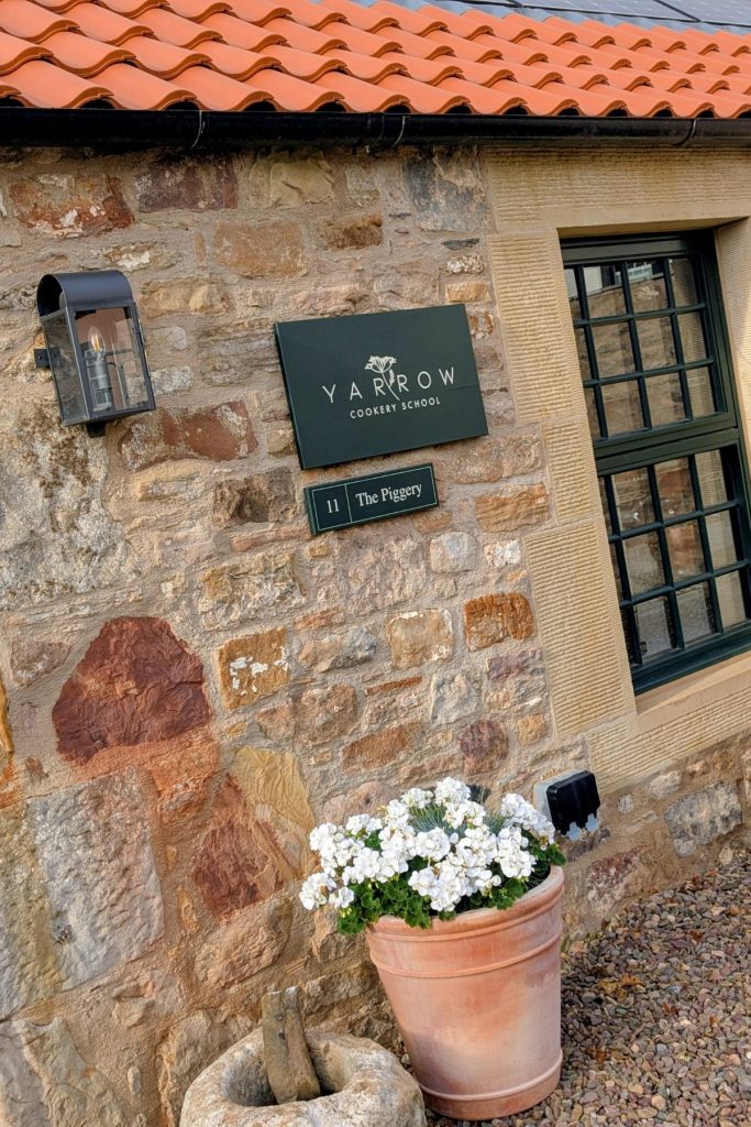 Yarrow's The Piggery window and flowers